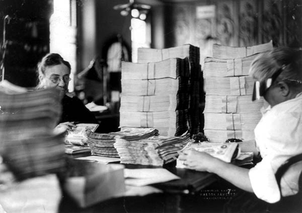 Counters verifying the counts of national banknote sheets.